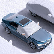 Car dustproof sunshade cover clothing on a BMW parked in a snowy area, showcasing its protective features.