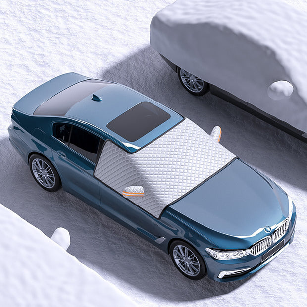 Car dustproof sunshade cover clothing on a BMW parked in a snowy area, showcasing its protective features.