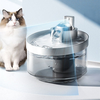 Wireless induction cat water fountain with flowing water and a cat nearby, promoting hydration for pets.