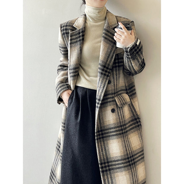 Retro double-faced woolen plaid coat displayed with long sleeves, paired with a turtleneck sweater.