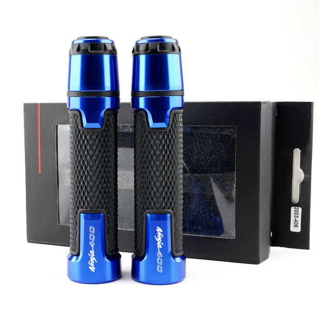 Two blue motorcycle silicone handle covers with a black textured grip beside packaging.
