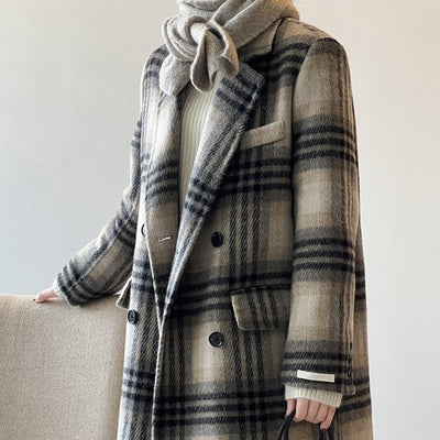 Stylish woman wearing a retro plaid double-faced woolen coat, showcasing its long sleeves and pocket design.