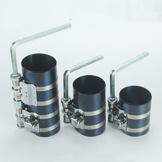 Piston ring compressor tool set with adjustable clamps for various piston sizes, ideal for engine assembly.