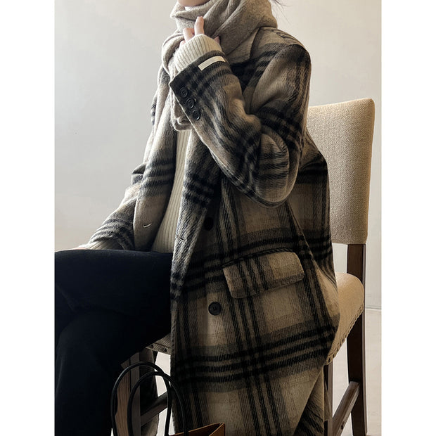 Model wearing a plaid double-faced woolen coat with long sleeves, showcasing a stylish retro look.